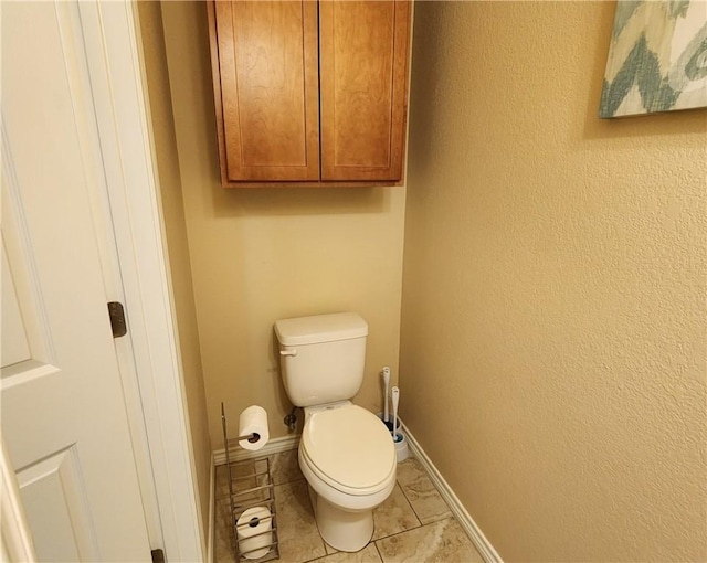 14878 Granada Dr Unit 502, Corpus Christi, TX 78418 - bathroom with toilet, tile patterned flooring, and baseboards