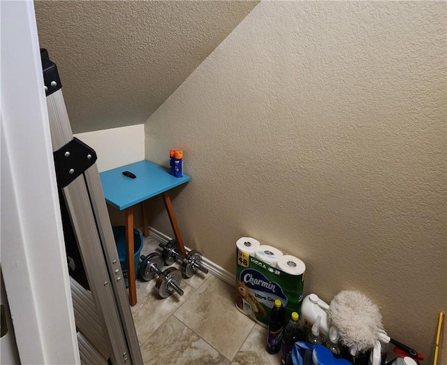 14878 Granada Dr Unit 502, Corpus Christi, TX 78418 - laundry room featuring baseboards, a textured wall, and a textured ceiling