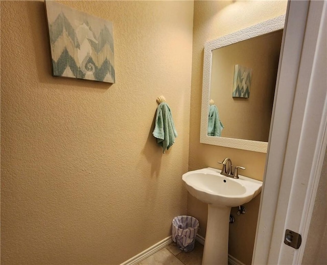 14878 Granada Dr Unit 502, Corpus Christi, TX 78418 - bathroom with tile patterned floors and baseboards