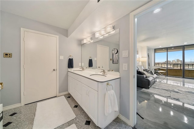 1400 Ocean Dr Unit 1104A, Corpus Christi, TX 78404 - full bathroom featuring double vanity, recessed lighting, and floor to ceiling windows