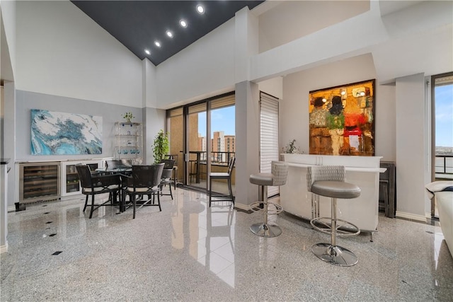 1400 Ocean Dr Unit 1104A, Corpus Christi, TX 78404 - dining room featuring wine cooler and a high ceiling