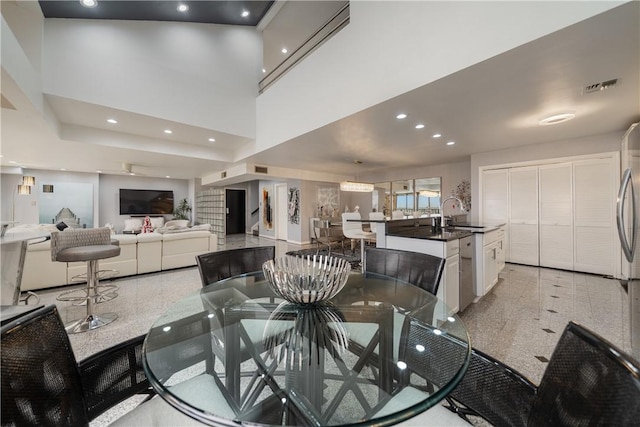 1400 Ocean Dr Unit 1104A, Corpus Christi, TX 78404 - dining area with granite tiled floors, recessed lighting, and a high ceiling
