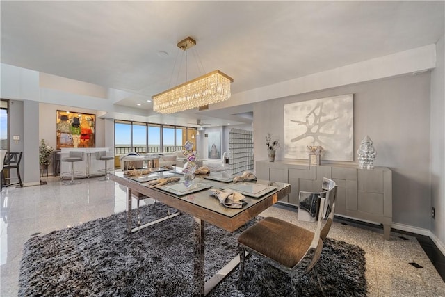 1400 Ocean Dr Unit 1104A, Corpus Christi, TX 78404 - dining room with granite floors, a chandelier, and healthy amount of natural light
