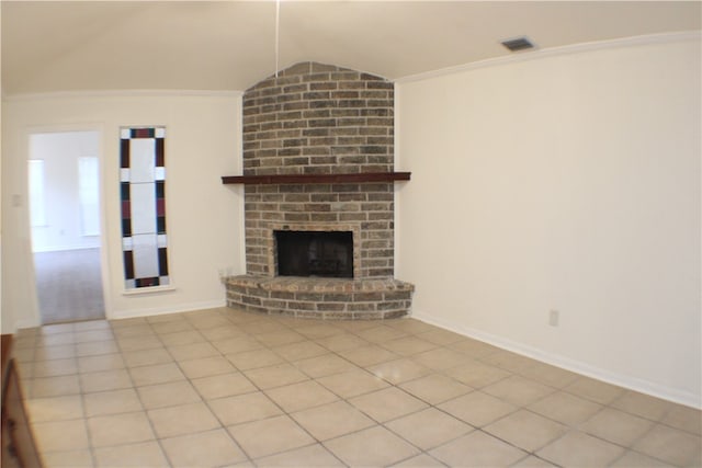 unfurnished living room featuring lofted ceiling, light tile patterned floors, and a brick fireplace