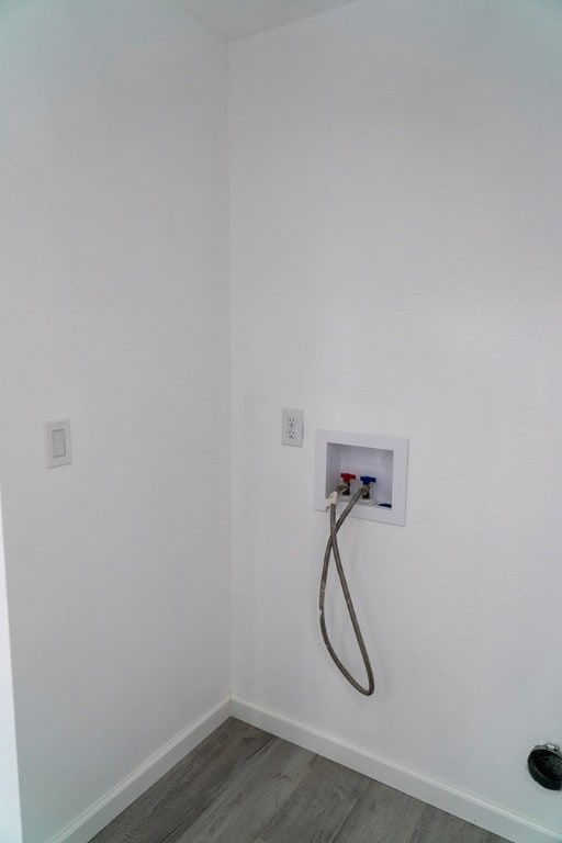 laundry room with dark wood-type flooring and washer hookup