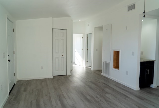 unfurnished room featuring light wood-type flooring