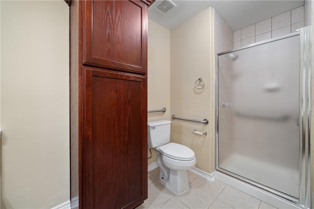 full bath with baseboards, toilet, tile patterned floors, and a stall shower
