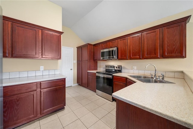 kitchen featuring light countertops, a sink, dark brown cabinets, and appliances with stainless steel finishes