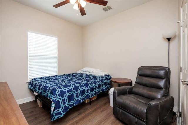 bedroom featuring ceiling fan and dark wood-type flooring