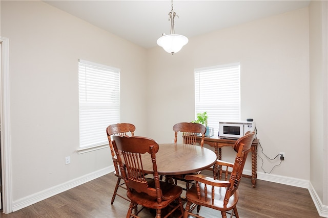 dining space featuring dark hardwood / wood-style floors