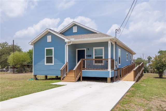 bungalow featuring a front yard