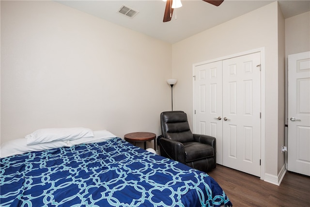 bedroom featuring a closet, ceiling fan, and dark hardwood / wood-style flooring