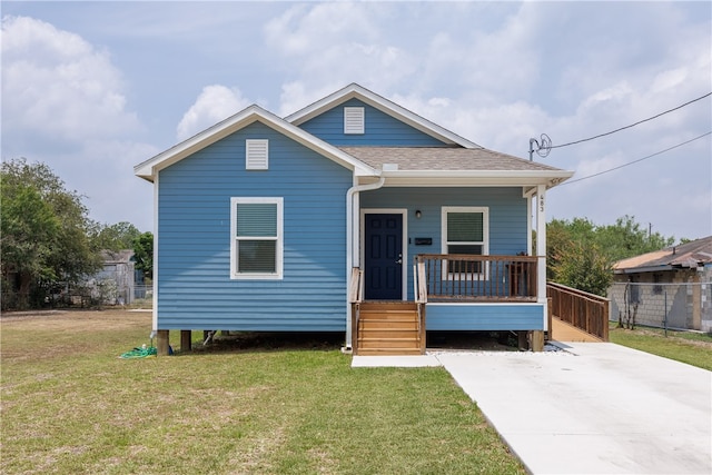 bungalow-style home with a front lawn