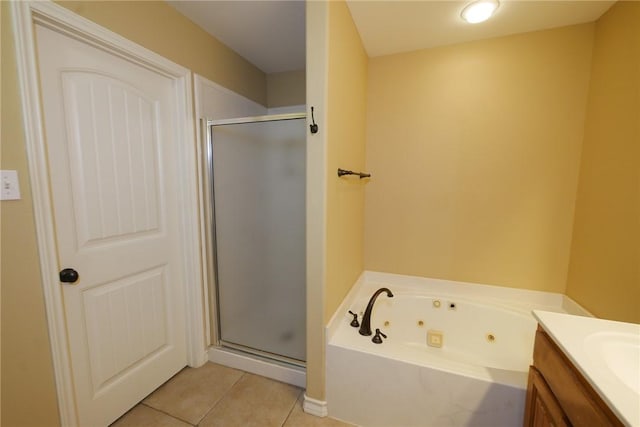 full bathroom with tile patterned flooring, vanity, a tub with jets, and a shower stall