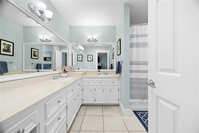 15269 Caravel Dr, Corpus Christi, TX 78418 - full bath featuring tile patterned floors, double vanity, and a shower with curtain