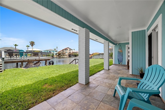 view of patio featuring a water view