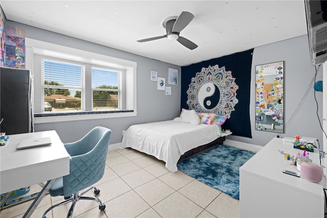 15269 Caravel Dr, Corpus Christi, TX 78418 - bedroom with light tile patterned floors, baseboards, a ceiling fan, and a desk
