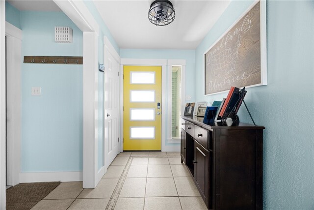 15269 Caravel Dr, Corpus Christi, TX 78418 - doorway to outside featuring light tile patterned floors and baseboards