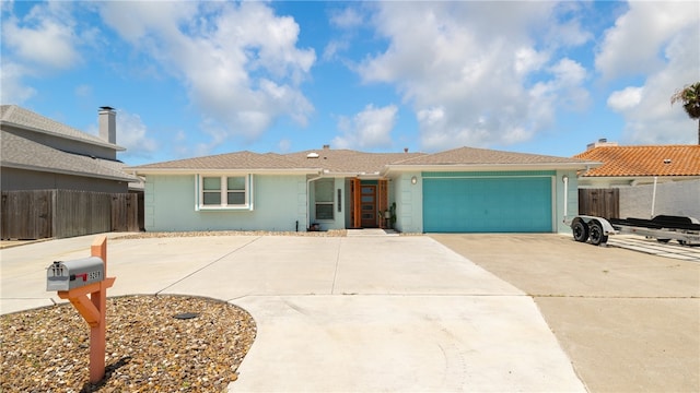 single story home featuring a garage