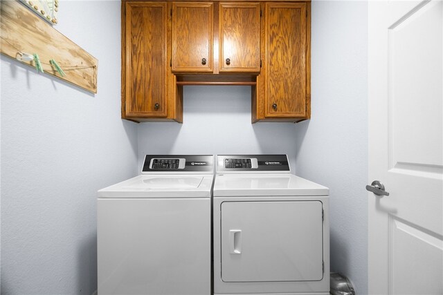 15269 Caravel Dr, Corpus Christi, TX 78418 - washroom featuring cabinet space and washing machine and clothes dryer