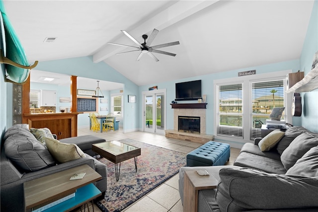 tiled living room with a fireplace, ceiling fan, and lofted ceiling with beams