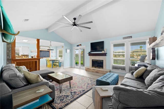 15269 Caravel Dr, Corpus Christi, TX 78418 - living room with a ceiling fan, light tile patterned floors, a glass covered fireplace, and baseboards
