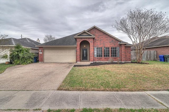 view of front of house featuring a garage and a front lawn