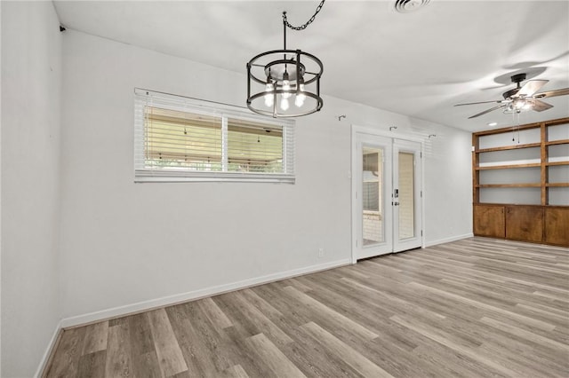 4414 Driftwood Pl, Corpus Christi, TX 78411 - unfurnished dining area featuring a chandelier, wood finished floors, baseboards, and ceiling fan