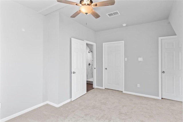 unfurnished bedroom with ceiling fan and light carpet