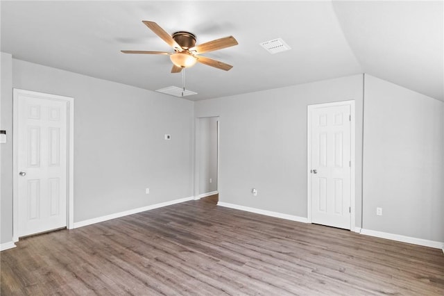 interior space featuring hardwood / wood-style flooring, ceiling fan, lofted ceiling, and multiple closets