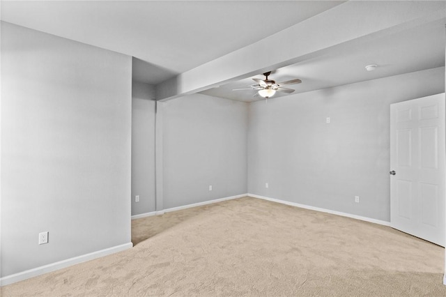 unfurnished room with ceiling fan and light colored carpet