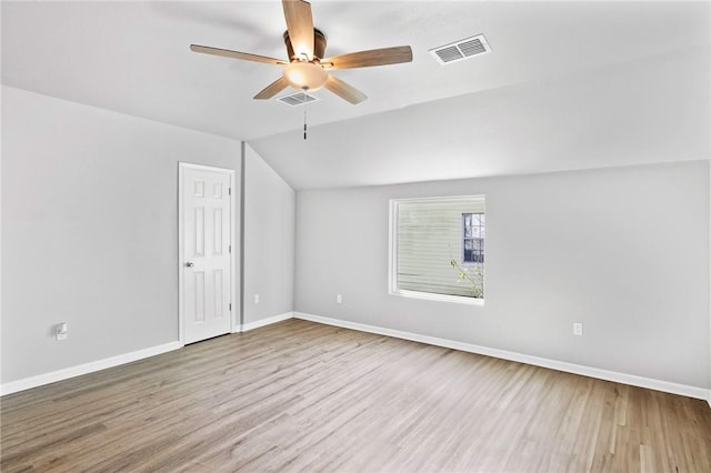 bonus room with hardwood / wood-style flooring, vaulted ceiling, and ceiling fan