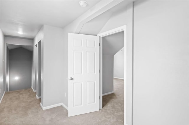 corridor with light colored carpet