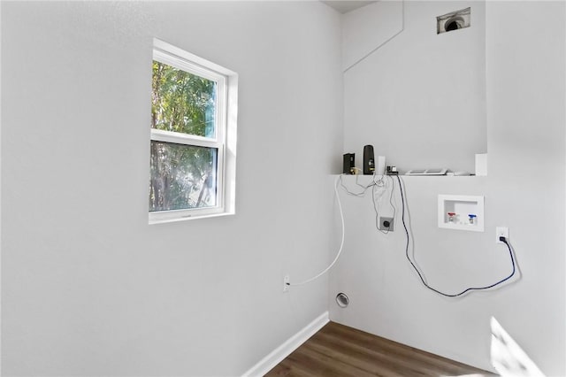 laundry area with dark wood-type flooring and washer hookup