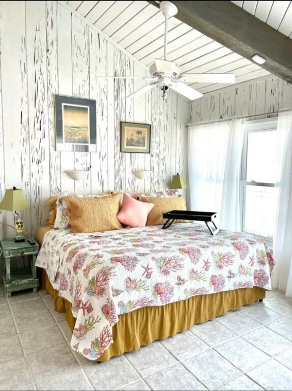1878 Bay Shore Dr, Rockport, TX 78382 - tiled bedroom featuring wooden ceiling and beamed ceiling