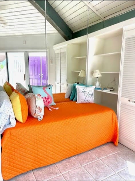 1878 Bay Shore Dr, Rockport, TX 78382 - tiled bedroom with beamed ceiling
