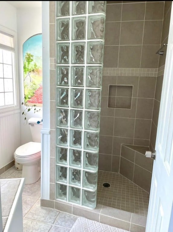 1878 Bay Shore Dr, Rockport, TX 78382 - full bath featuring tile patterned floors, toilet, and a walk in shower