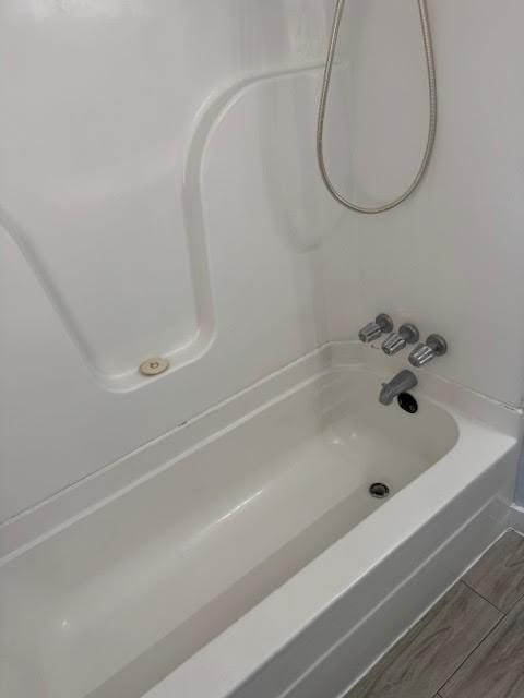 bathroom featuring washtub / shower combination