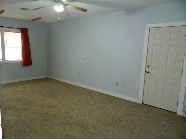 unfurnished room with ceiling fan and carpet flooring