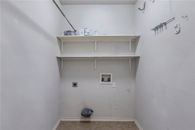 clothes washing area featuring hookup for a washing machine, light tile patterned floors, and hookup for an electric dryer