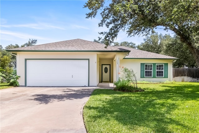 ranch-style home featuring a garage and a front lawn