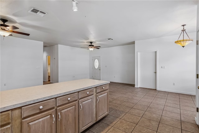 kitchen featuring light tile patterned floors, decorative light fixtures, and ceiling fan