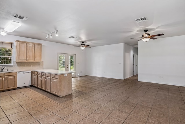 kitchen with ceiling fan, dishwasher, light brown cabinets, and kitchen peninsula