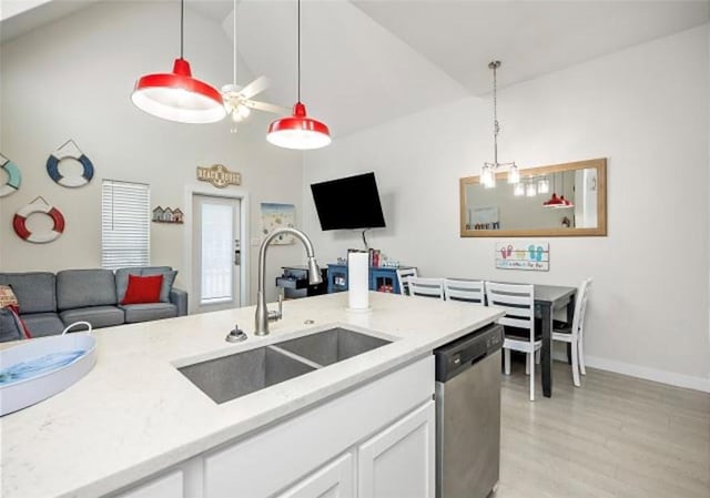 kitchen with pendant lighting, dishwasher, white cabinetry, sink, and light wood-type flooring