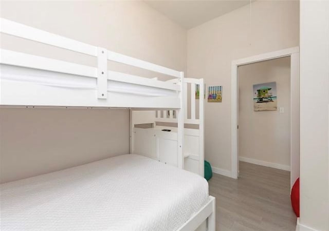 bedroom with hardwood / wood-style flooring