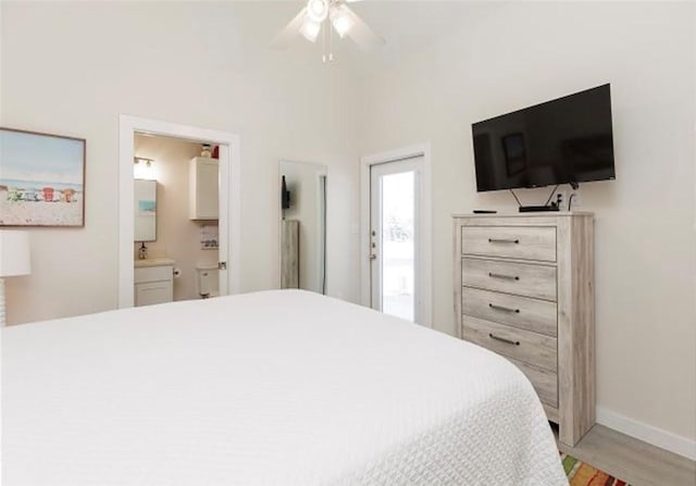 bedroom featuring ceiling fan, connected bathroom, and light wood-type flooring