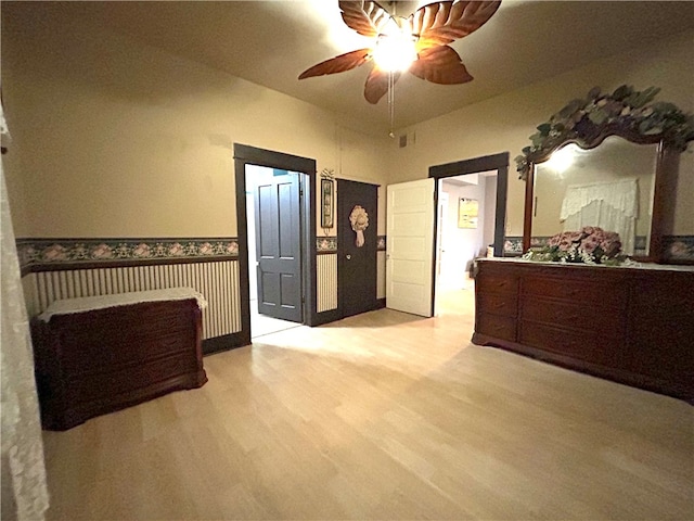 bedroom featuring ceiling fan and light wood-type flooring