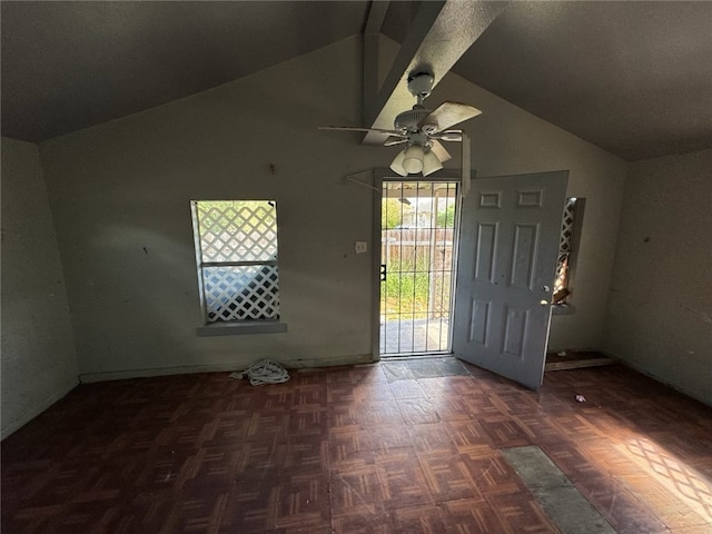 foyer featuring dark parquet floors, lofted ceiling, and ceiling fan