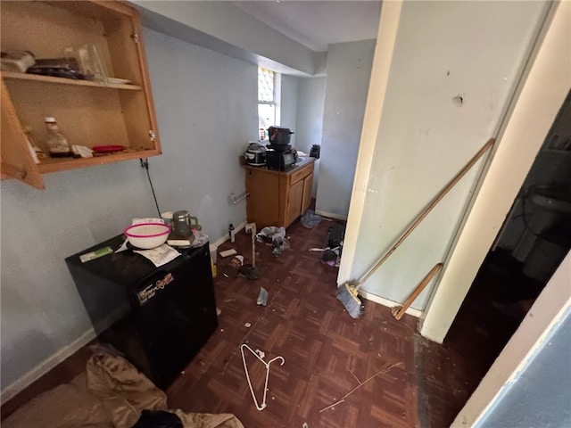 interior space with dark parquet flooring