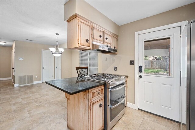 11809 Lori Dr, Corpus Christi, TX 78410 - kitchen with range with two ovens, light brown cabinets, baseboards, and dark countertops